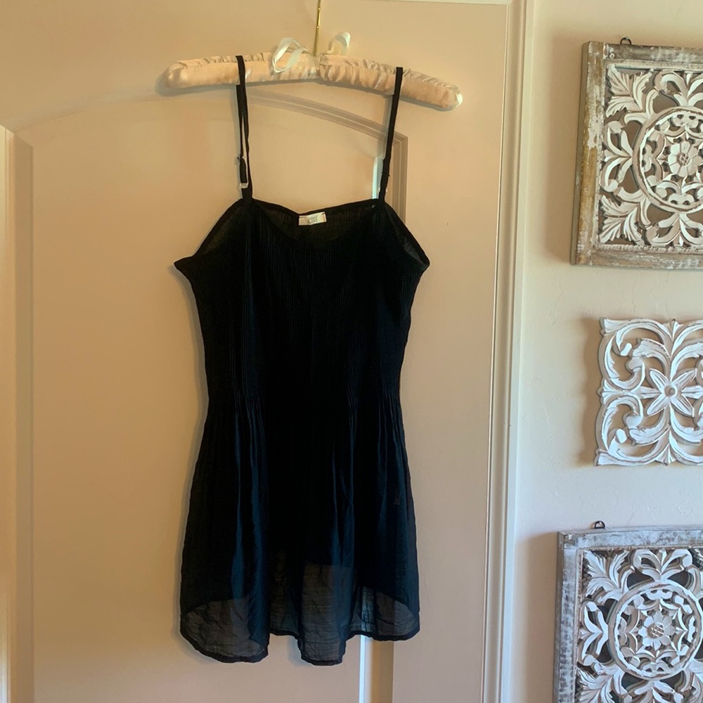 FLATTERING Black tank, NWOT. Was a gift and runs a little too small for me